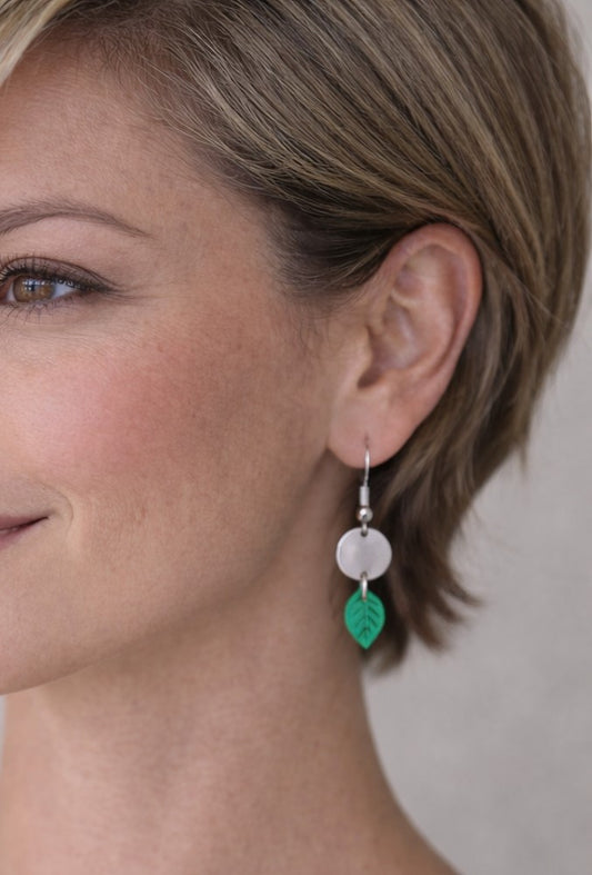 Covaly Silver circle with a small green leaf hanging Earring
